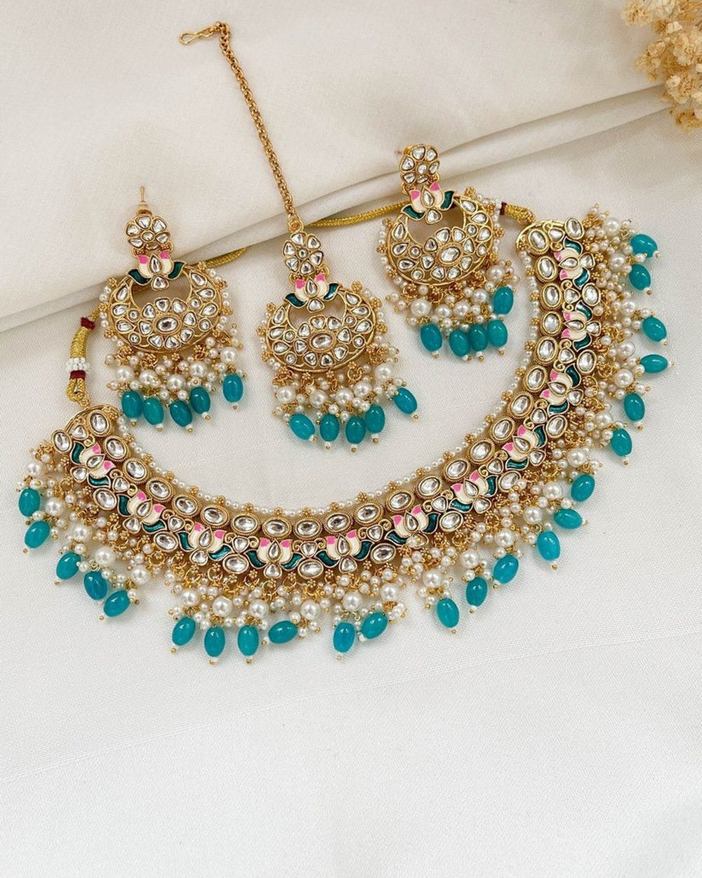 Elegant traditional Kundan necklace and earring set with blue gemstones